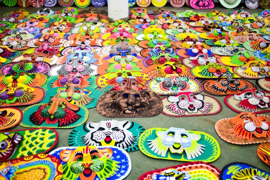 Colourful masks made by students of the Art Institute of Dhaka University lie on the ground in preparation for the Bengali New Year celebration, in Dhaka on April 7, 2019. The Bengali calendar is solar, with the year beginning on Pohela Boishakh, which falls on April 14 this year, in Bangladesh. / AFP / Munir UZ ZAMAN