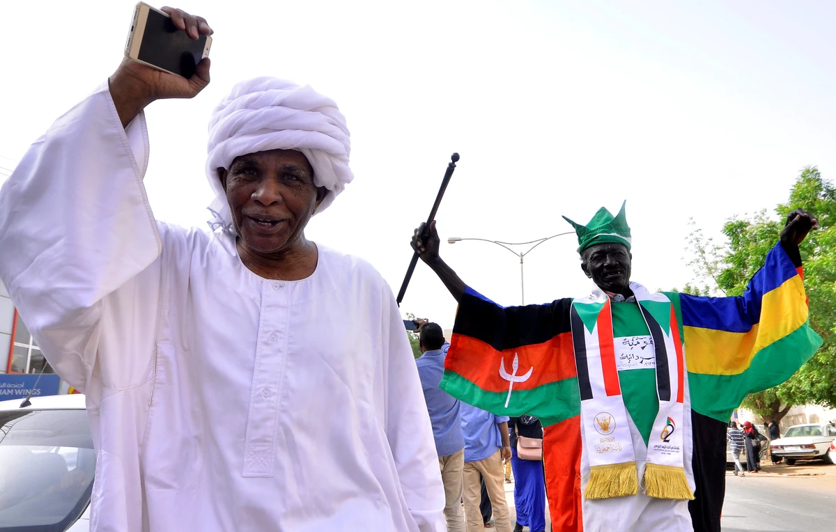 Demonstrators chant slogans along the streets of Khartoum following the removal of Omar Al-Bashir. (Reuters)