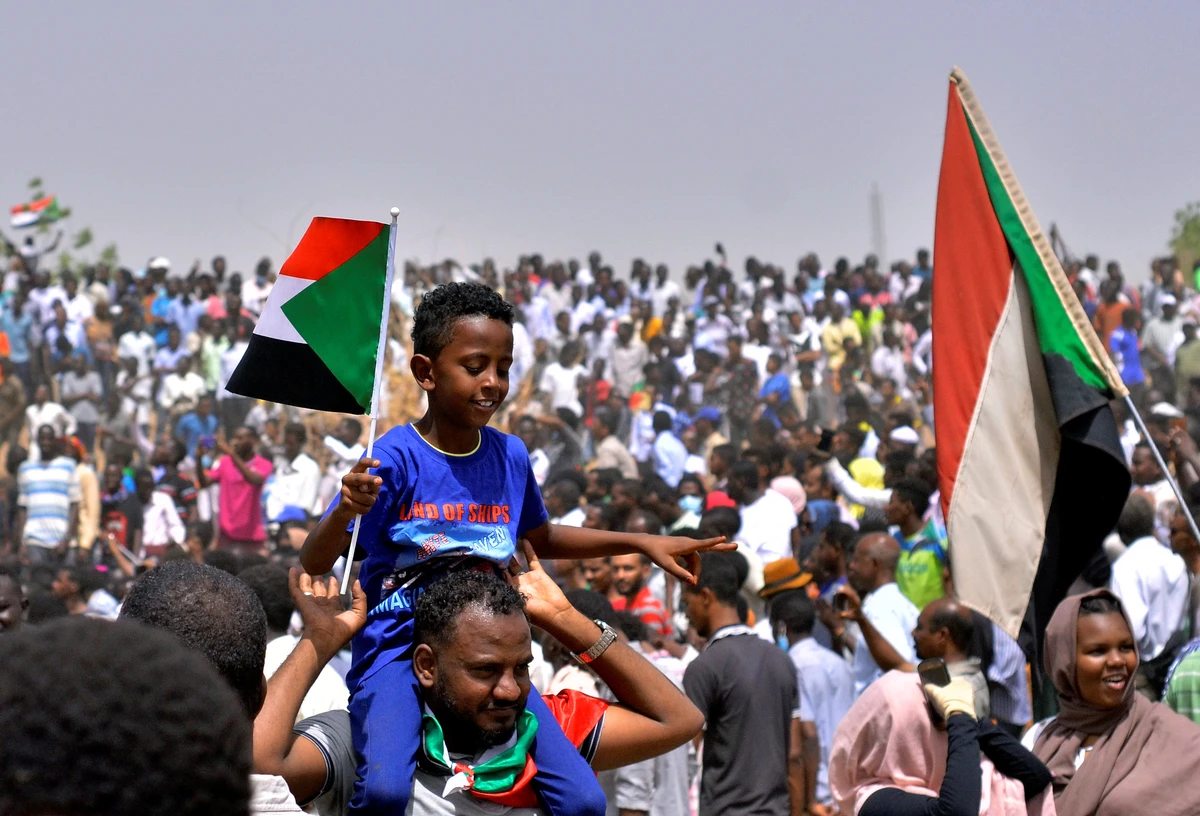 Sudanese demonstrators gather in a street in central Khartoum on April 11, 2019, immediately after one of Africa's longest-serving presidents was toppled by the army. (AFP)