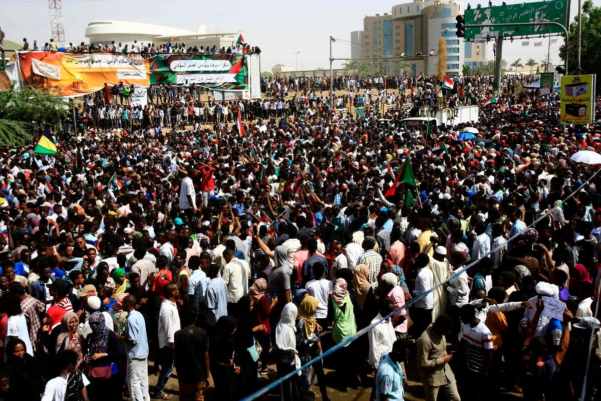 Sudanese demonstrators gather in a street in central Khartoum on April 11, 2019, immediately after one of Africa's longest-serving presidents was toppled by the army. (AFP)