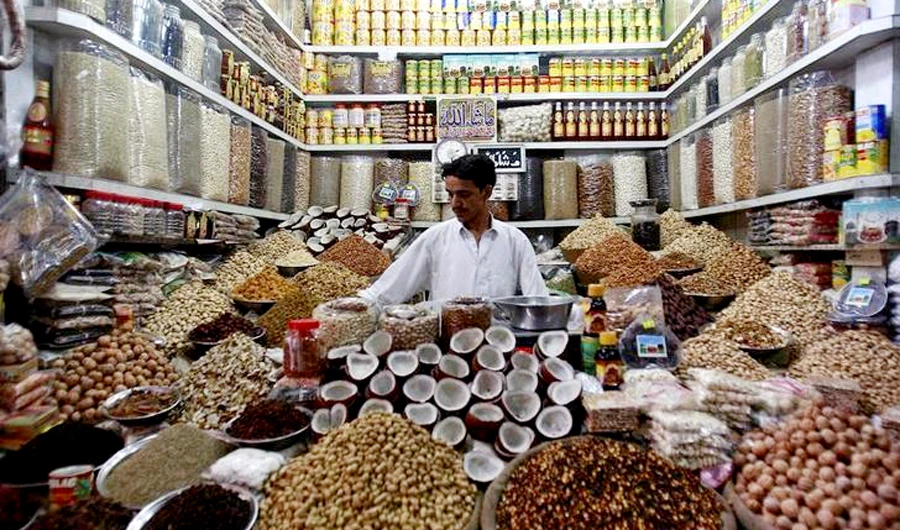 In this file photo, a dry-fruit seller waits for customers at a wholesale market in Karachi. Inflationary pressure has been steadily building in Pakistan’s economy, rising to 9.41 percent in March and forcing the central bank of the country to lift its key policy rate by 50 basis points to 10.75 percent last Friday. (Reuters)