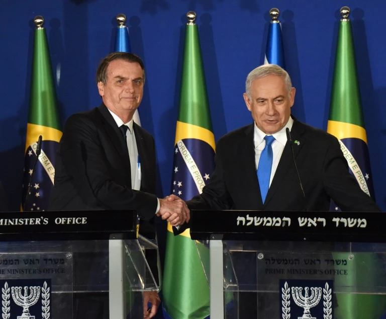 Brazilian President Jair Bolsonaro (L) and Israeli Prime Minister Benjamin Netanyahu shake hands during a joint press conference at the prime minister's residence in Jerusalem on March 31, 2019. (AFP)
