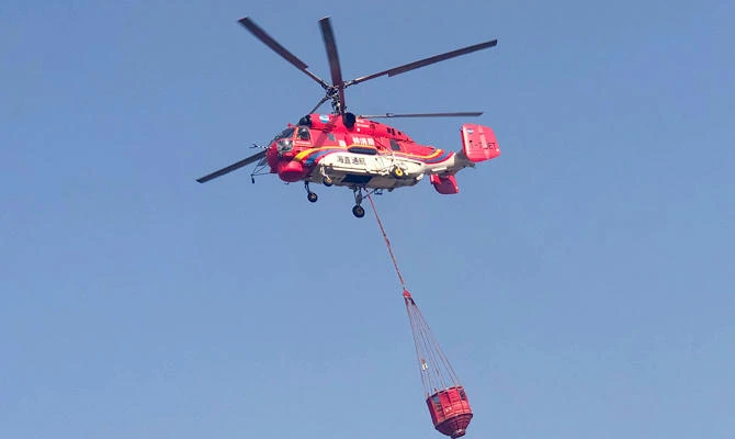 In this photo released by Xinhua News Agency, a fire-fighting helicopter leaves on a mission to fight aforest fire in the Muli County in Liangshan Yi Autonomous Prefecture from an airport in Xichang, southwest China's Sichuan Province, Monday, April 1, 2019. (AP)