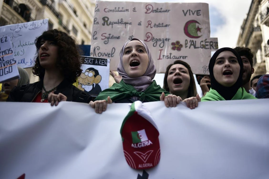 Algerian students take part in a demonstration against the current government in the capital Algiers on April 2, 2019. Algeria's ailing President Abdelaziz Bouteflika will resign before his mandate expires on April 28, his office said, after a succession of loyalists deserted him in the face of massive protests. (AFP)