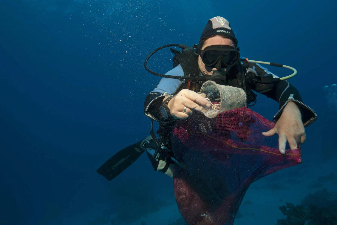 In this June 8, 2018 photo, divers collect plastic and other debris during a cleanup organized by Camel Dive Club, at a dive site off the coast of the Red Sea resort of Sharm el Sheik, in Southern Sinai, Egypt. (AP)