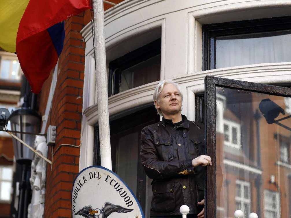 WikiLeaks founder Julian Assange greets supporters outside the Ecuadorian embassy in London in this May 19, 2017 file photo. (AP)