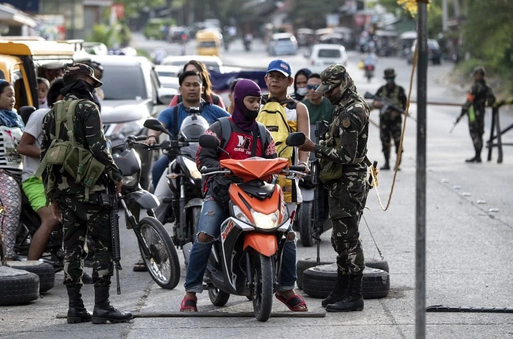 Security forces check identification at a checkpoint on the southern Philippine island of Mindanao in this January 20, 2019 file photo. (AFP)