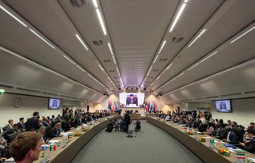 OPEC President UAE Energy Minister Suhail al-Mazrouei (C) speaks as he sits with Minister of Energy of Russia Alexander Novak (left) and OPEC Secretary General Mohammed Sanusi Barkindo (r) of Nigeria during a meeting at the headquarters of the Organization of the Petroleum Exporting Countries (OPEC) with OPEC members and non-OPEC members in Vienna, Austria on December 7, 2018. JOE KLAMAR / AFP