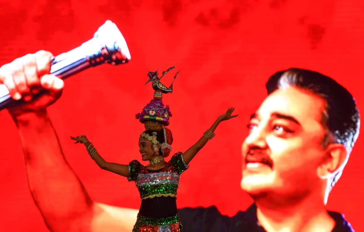 Drummers and dancers heave to Kamal Haasan's blockbuster hits, whipping a huge crowd into ecstasy just as the megastar himself steps onto stage. (AFP)
