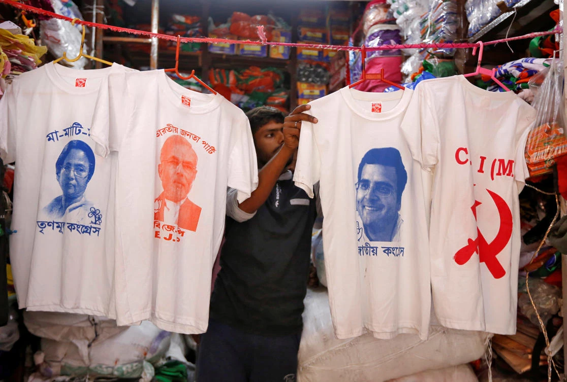 Campaign shirts for sale inside a shop at a market ahead of India’s general election in Kolkata. (Reuters)