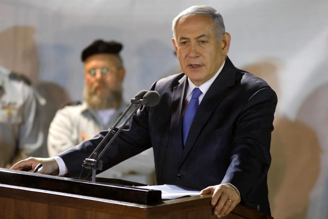 Benjamin Netanyahu attends the funeral of Israeli soldier Zachary Baumel at the Mount Herzl military cemetery in Jerusalem. The body of Baumel had been missing since the 1982 Lebanon War. (AFP)