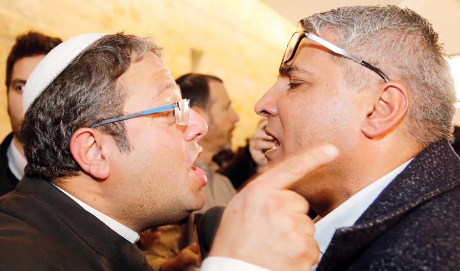 Jewish Power party’s Itamar Ben Gvir, left, argues with the Israeli Arab candidate Ata Abu Medeghem of Raam-Balad in Jerusalem on March 14. (AFP)