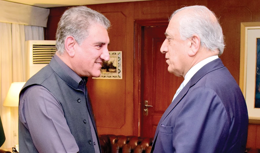 Pakistan’s Foreign Minister Shah Mehmood Qureshi receives Zalmay Khalilzad, US special representative for Afghanistan, in Islamabad on Friday. (AP)