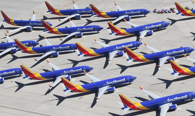 In this file photo taken on March 28, 2019 Southwest Airlines Boeing 737 MAX aircraft are parked on the tarmac after being grounded, at the Southern California Logistics Airport in Victorville, California. (AFP)