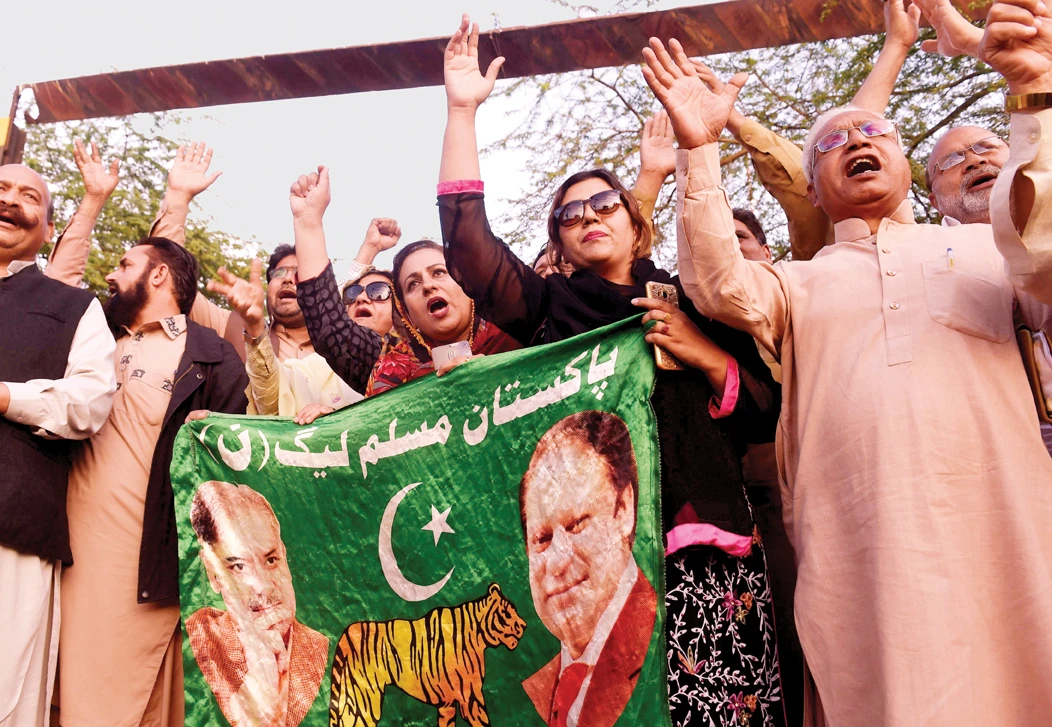 Supporters of former Prime Minister Nawaz Sharif stage a protest in Lahore on March 26. (AFP file photo)