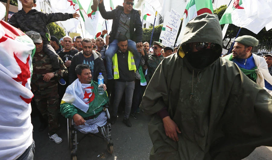 Former soldiers join a rally in Algiers on April 5, 2019, chanting, singing and cheering after their movement forced out longtime President Abdelaziz Bouteflika — and demanding that other top figures leave too. (AP Photo/Toufik Doudou)