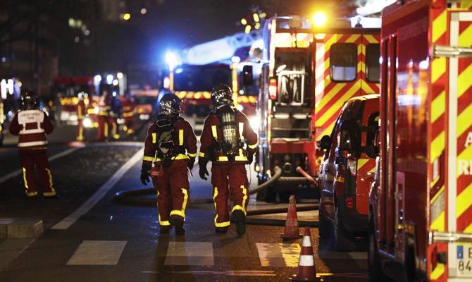 Firefighters are seen during an operation to put out a fire that broke out on an appartment building, on April 6, 2019 in Paris. (AFP)