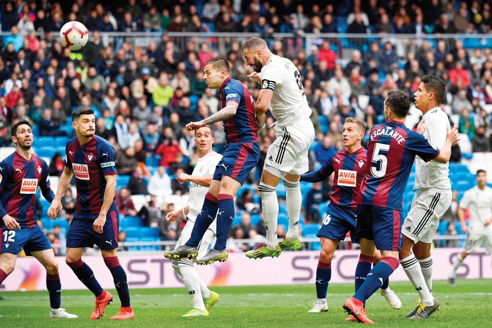 Real Madrid’s French forward Karim Benzema scores a goal against Eibar during the Spanish league football match in Madrid on Saturday. (AFP)