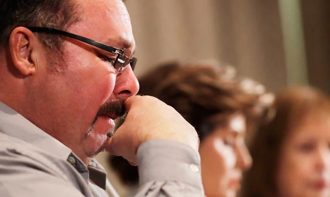 Mark Borowski reacts during a news conference in Rosemont, Ill., Friday, March 29, 2019. (AP)
