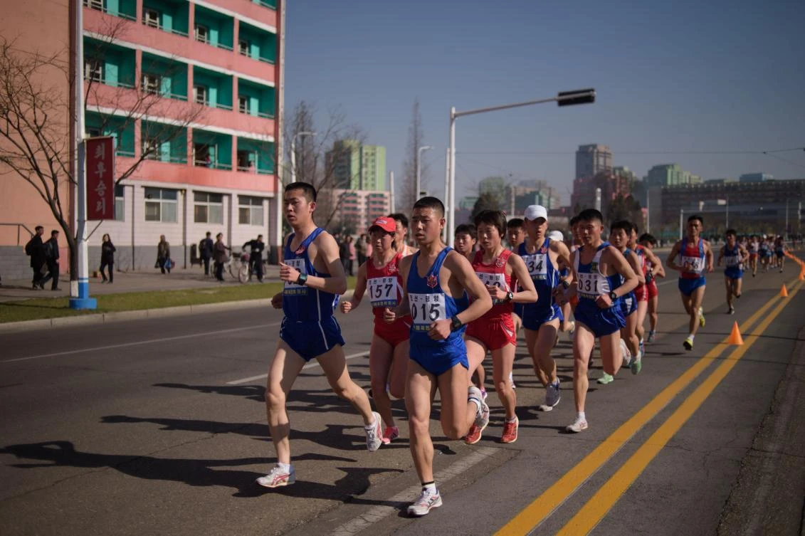 Competitors from North Korea run along a road during the annual ‘Mangyongdae Prize International Marathon’ in Pyongyang on April 7, 2019. (AFP/Kim Won Jin)