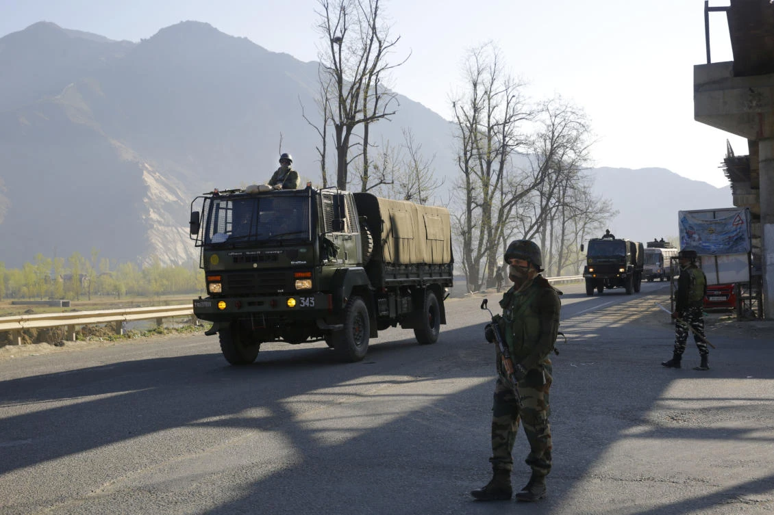 An Indian army soldier stands guard as a convoy moves on a highway on the outskirts of the Indian-controlled Kashmir in this February 7, 2019 photo. (AP)