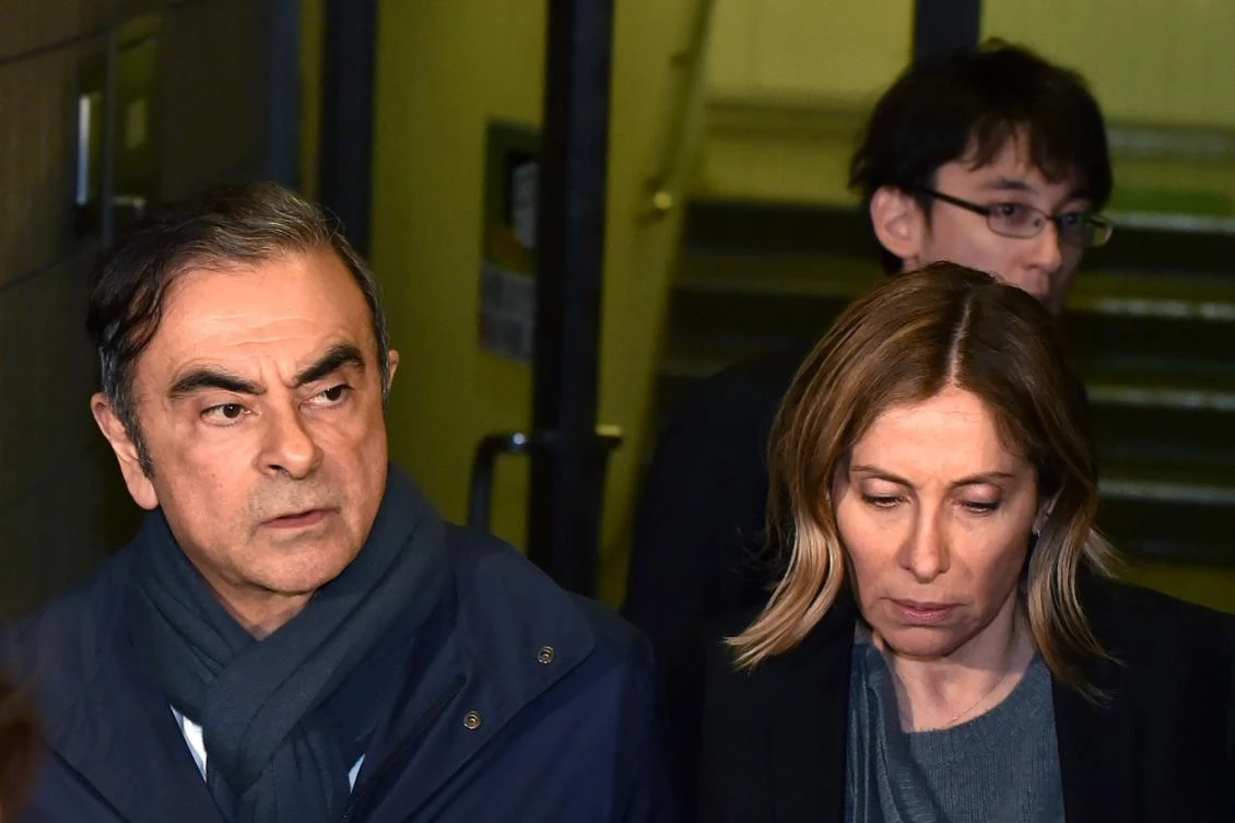 Former Nissan chairman Carlos Ghosn, left, and his wife Carole leave the office of his lawyer Junichiro Hironaka in Tokyo on April 3, 2019. (AFP)