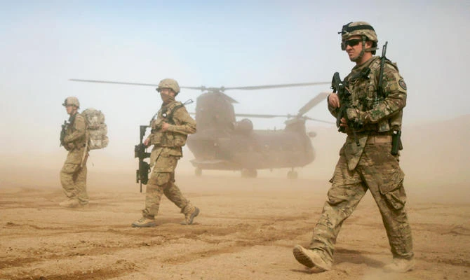 In this Saturday, Jan. 28, 2012 file photo, U.S. soldiers, part of the NATO- led International Security Assistance Force (ISAF) walk west of Kabul, Afghanistan. (AP)