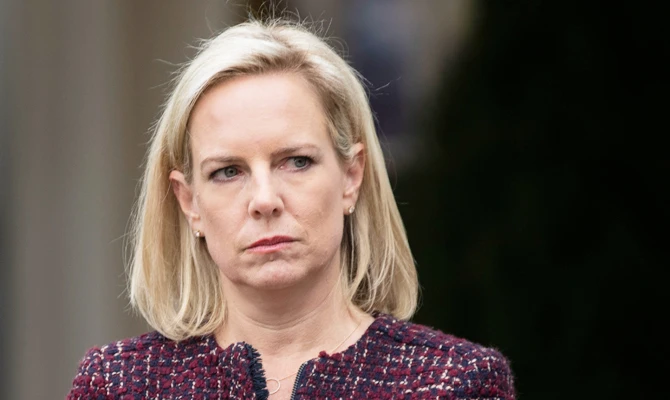 In this file photo taken on January 04, 2019, US Secretary of Homeland Security Kirstjen Nielsen listens as US President Donald Trump addresses a press conference in the Rose Garden of the White House following a meeting with Congressional leaders on the government shutdown in Washington, DC. (AFP)