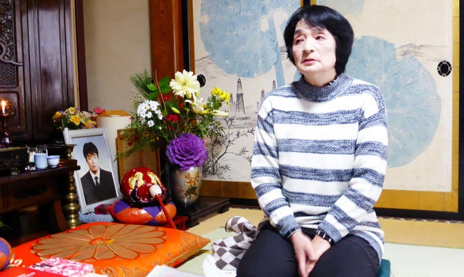 Taeko Watanabe, whose son Yuki who committed suicide in 2008, talks in front of his portrait at her home in Akita, Japan February 9, 2019. (REUTERS)