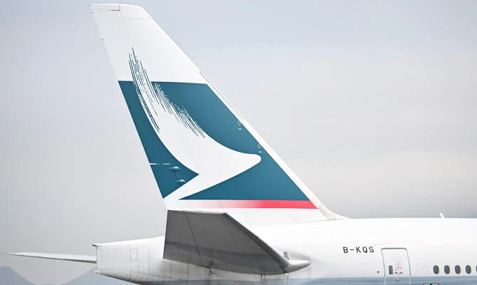 In this file photo taken on March 13, 2019, the Cathay Pacific logo is seen on the tail of a passenger plane as it prepares to take off from Hong Kong's international airport. (AFP)