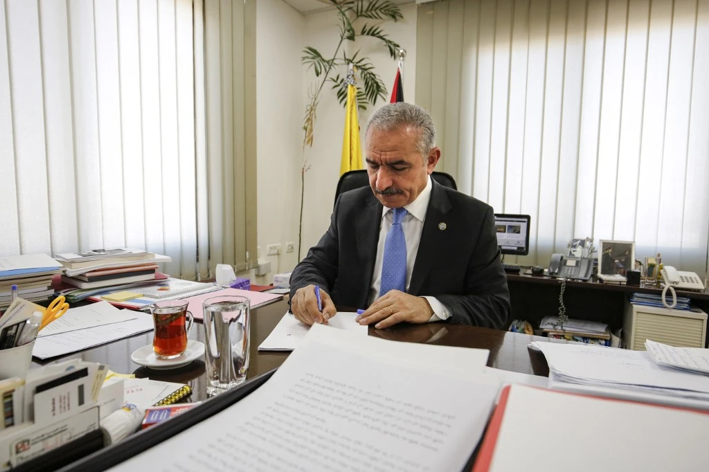 Mohammad Shtayyeh, above, and Mahmoud Abbas will decide which members will join the new government. (AFP/File)