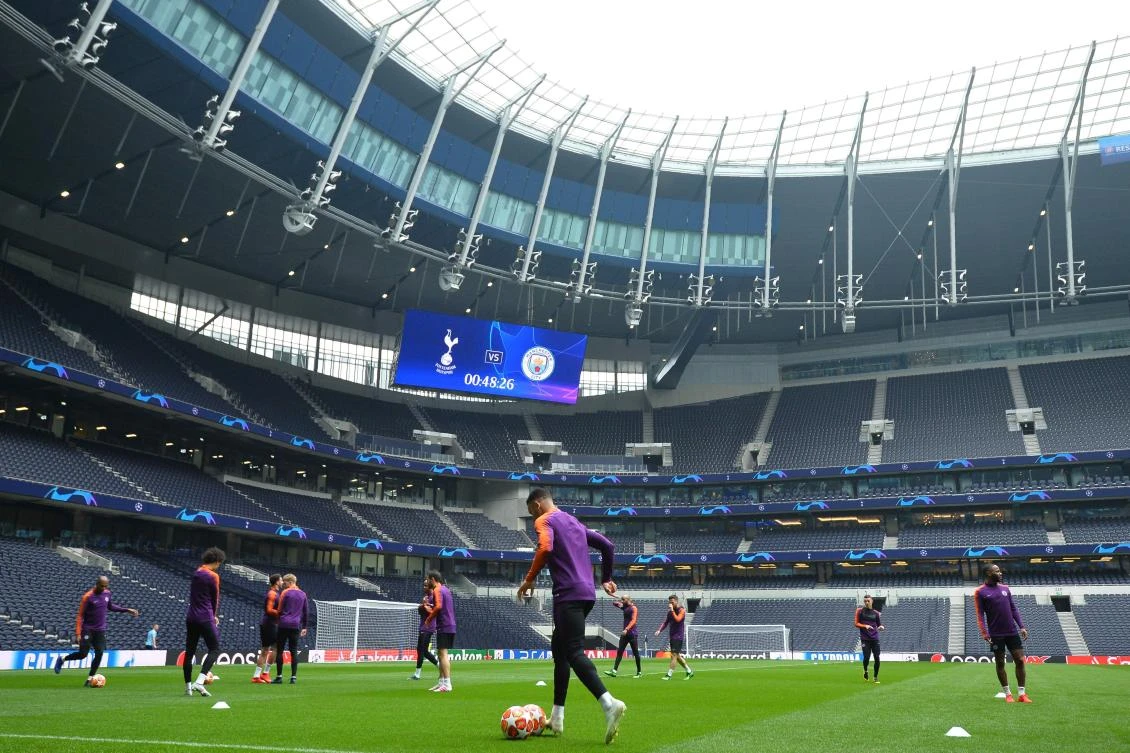 Manchester City's players take part in a team training session at Tottenham Hotspur Stadium on the eve of their UEFA Champions League quarter final first leg match. (AFP)