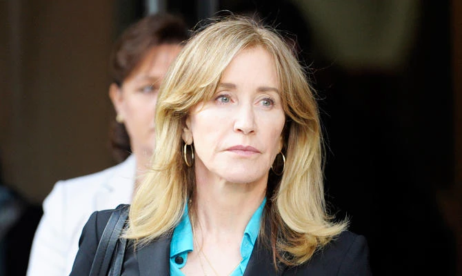 In this file photo taken on April 3, 2019, actress Felicity Huffman exits the courthouse after facing charges for allegedly conspiring to commit mail fraud and other charges in the college admissions scandal at the John Joseph Moakley United States Courthouse in Boston. (AFP)