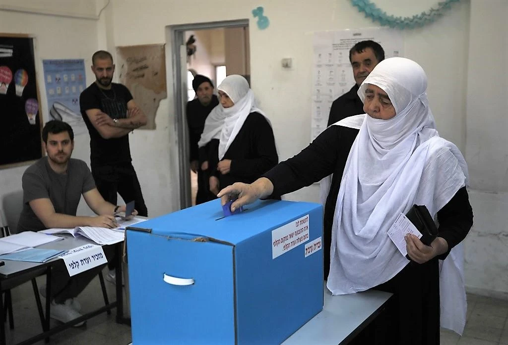 An Arab Israeli woman casts her vote in Daliyat Al-karmel in northern Israel. (AFP)