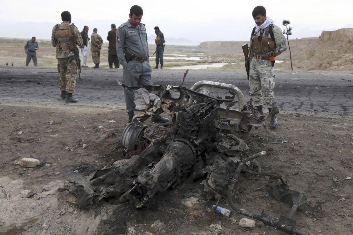 Afghan security forces secure the site of Monday’s suicide attack near Bagram Air Base, north of Kabul, Afghanistan. (AP)