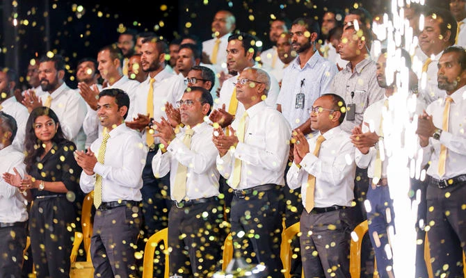In this file photo taken on February 1, 2019, Maldives' former president Mohamed Nasheed (3L), with current President Ibrahim Mohamed Solih (4R), takes part in an election rally after securing his party's ticket from the Maldives Democratic Party (MDP) to stand in upcoming parliamentary polls in Male. (AFP)