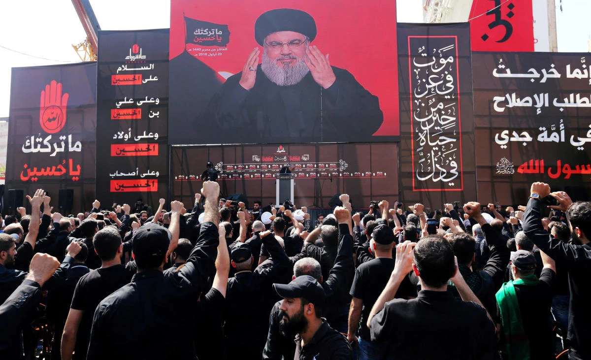 Hezbollah leader Sayyed Hassan Nasrallah addresses supporters via a screen in Beirut, Lebanon, September 20, 2018. (Reuters)