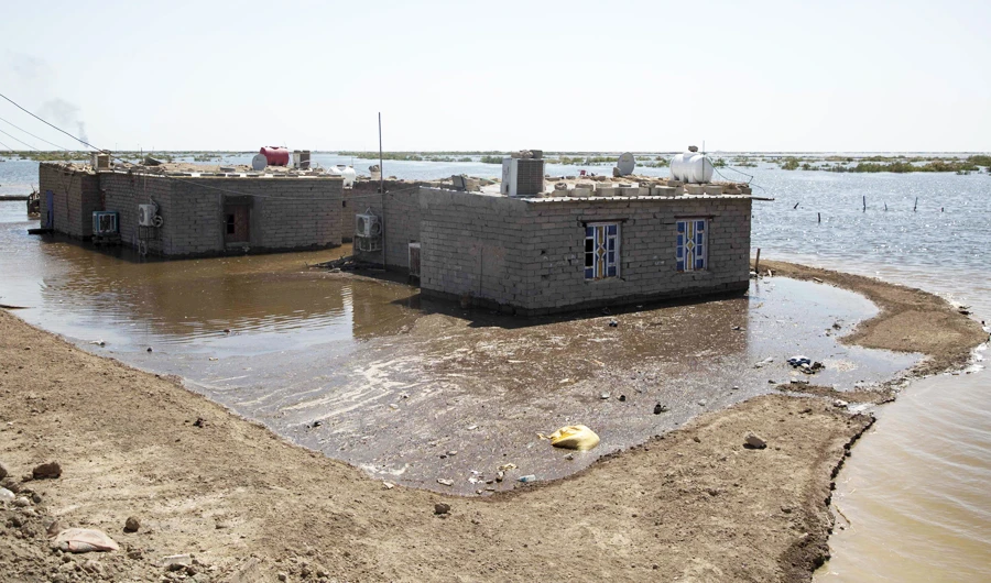 Flooded houses are pictured in southern Iraq's al-Qurna district, north of Basra. (AFP)