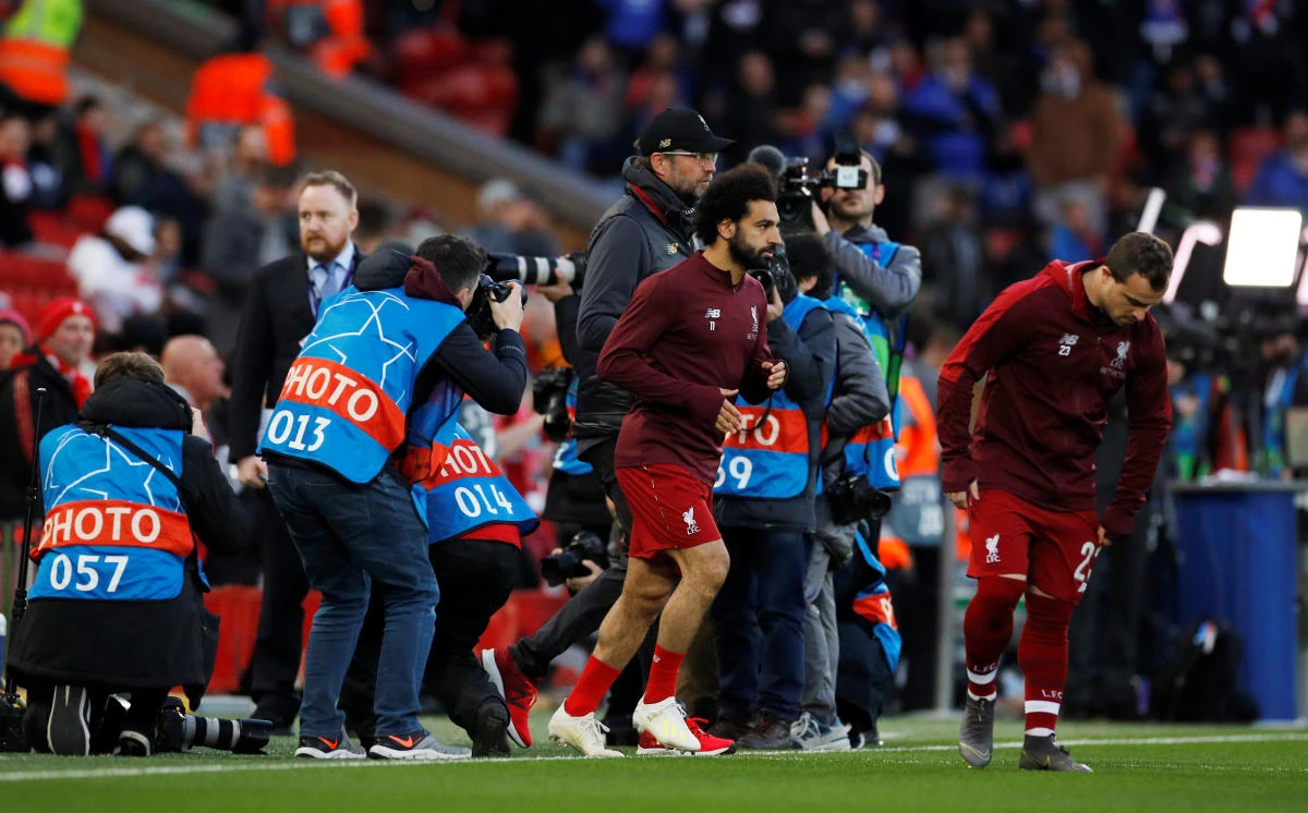 Liverpool manager Jurgen Klopp and Mohamed Salah during the warm up before the Champions League quarter-final first-leg game between Liverpool and FC Porto at Anfield. (Reuters)
