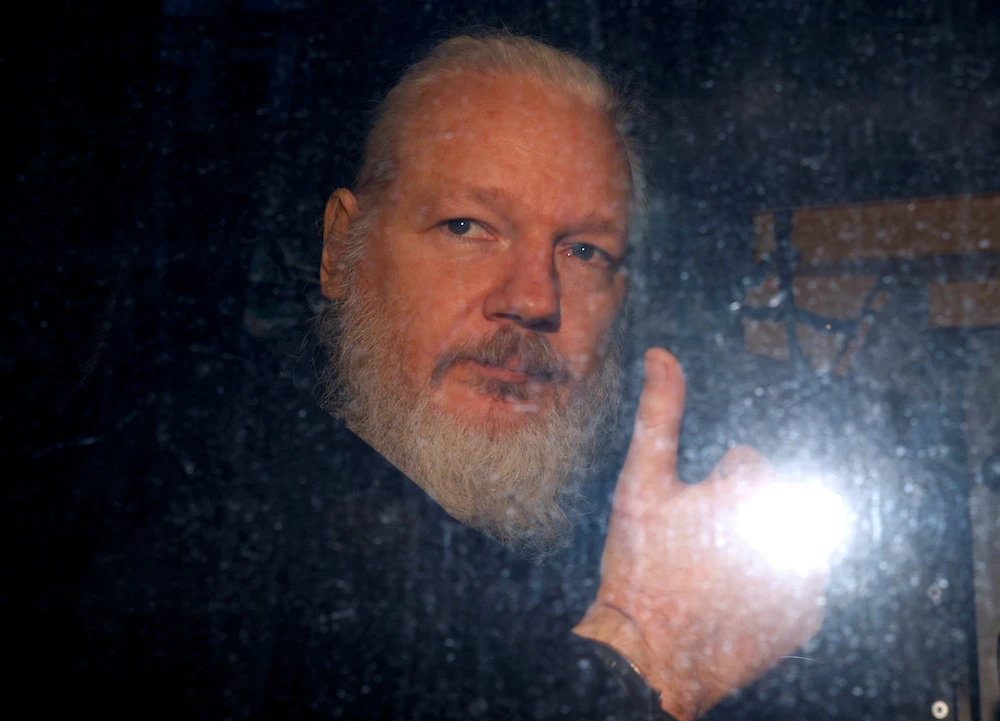 WikiLeaks founder Julian Assange is seen as he leaves a police station in London, Britain April 11, 2019. (Reuters)
