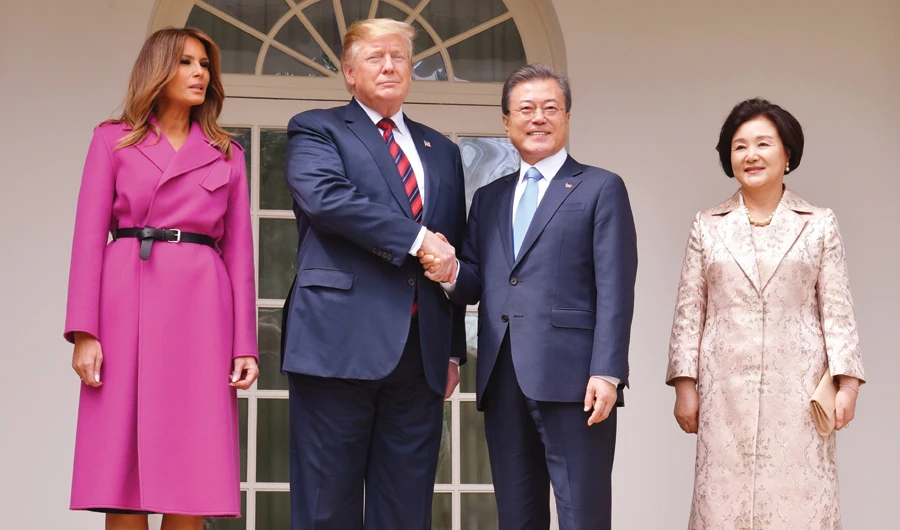US President Donald Trump and first lady Melania Trump welcome South Korean President Moon Jae-in and his wife Kim Jung-sook to the White House. (AFP)