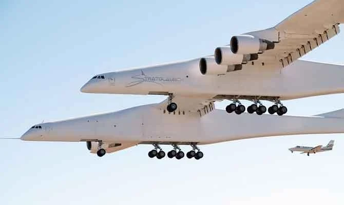 This handout photograph obtained courtesy of Stratolaunch shows the Stratolaunch plane flying over the California desert, April 13, 2019, the first test flight of the US company's gigantic aircraft whose wingspan is almost half that of an Airbus A380. (AFP)