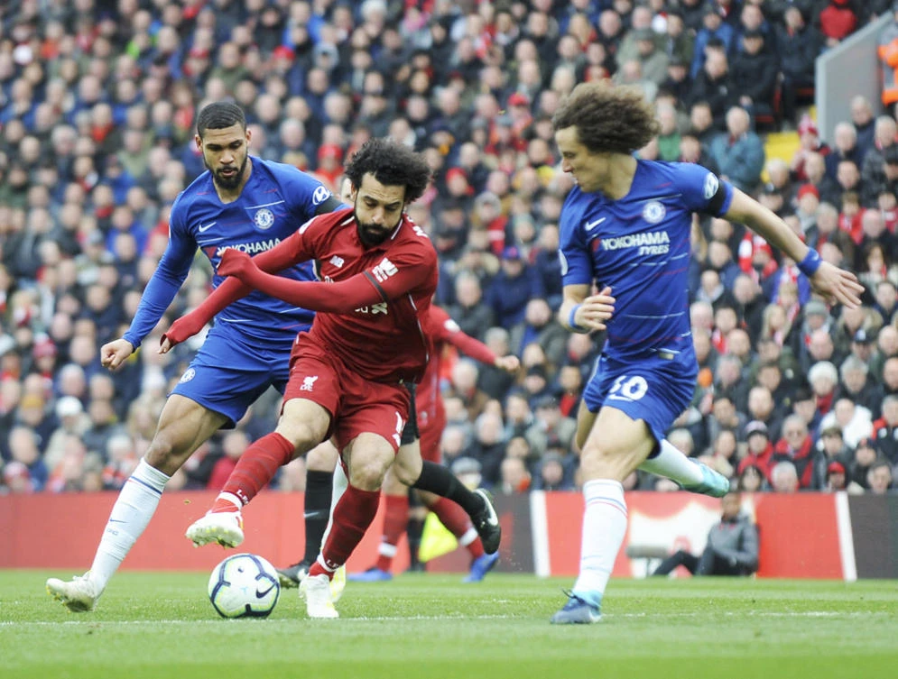 Mohamed Salah duels for the ball with Chelsea's Ruben Loftus-Cheek. (AP)