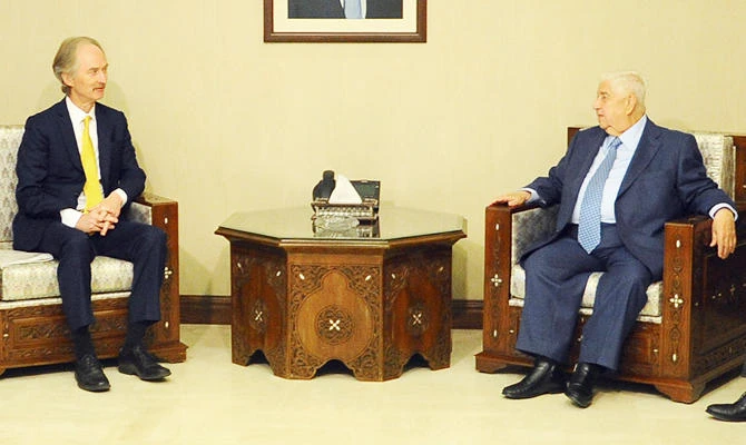 A handout photo released by the official Syrian Arab News Agency (SANA) on April 14, 2019 shows Deputy Prime Minister of Syria Walid Muallem meeting with United Nations Special Envoy to Syria Geir Pedersen in the Syrian capital Damascus. (AFP)