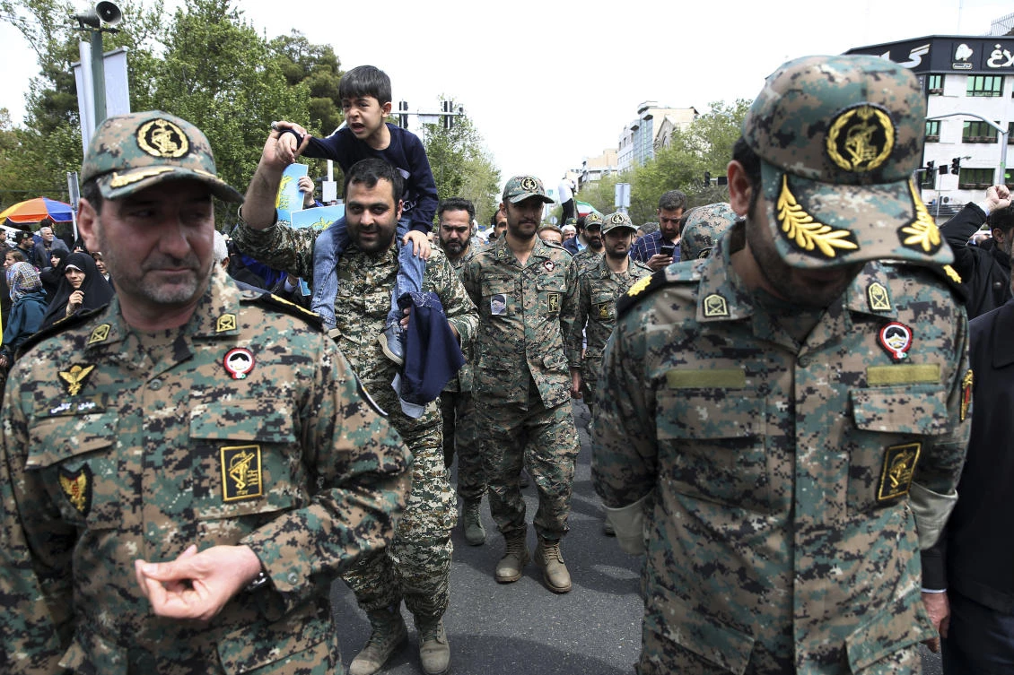Members of the Iran's powerful Revolutionary Guards attend a rally against the U.S.'s decision to designate the guard as a foreign terrorist organization, after the Friday prayers at the Enqelab-e-Eslami (Islamic Revolution) street in Tehran, Iran, Friday, April 12, 2019. (AP)