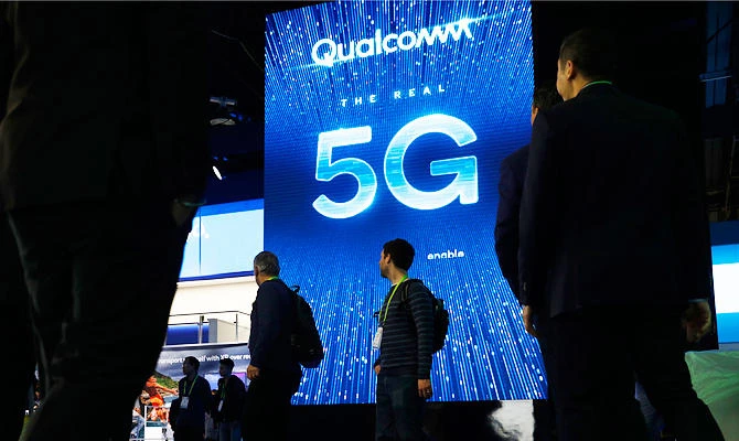 In this Jan. 9, 2019, file photo a sign advertises 5G at the Qualcomm booth at CES International in Las Vegas. (AP)