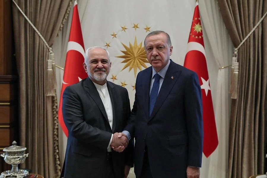Turkish President Recep Tayyip Erdogan with Iran’s Foreign Minister Mohammad Javad Zarif on April 17. (AFP)