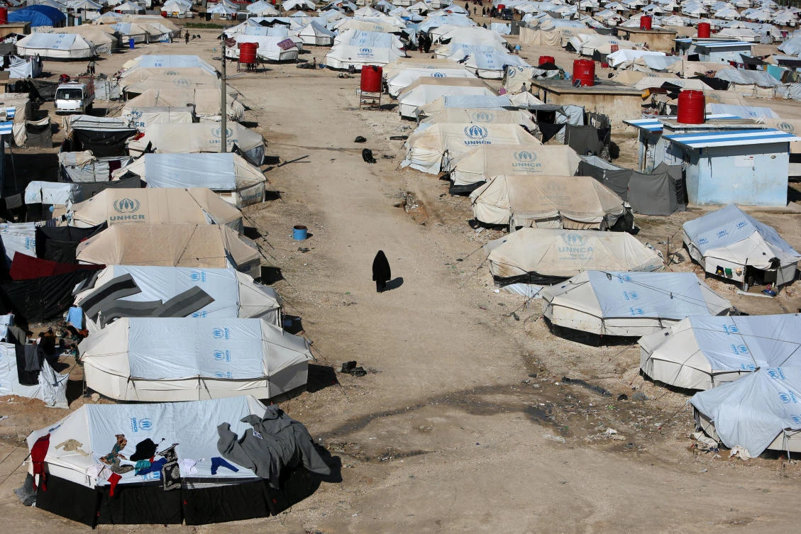 A woman walks through Al-Hol displacement camp in Hasaka governorate, Syria. (File/Reuters)