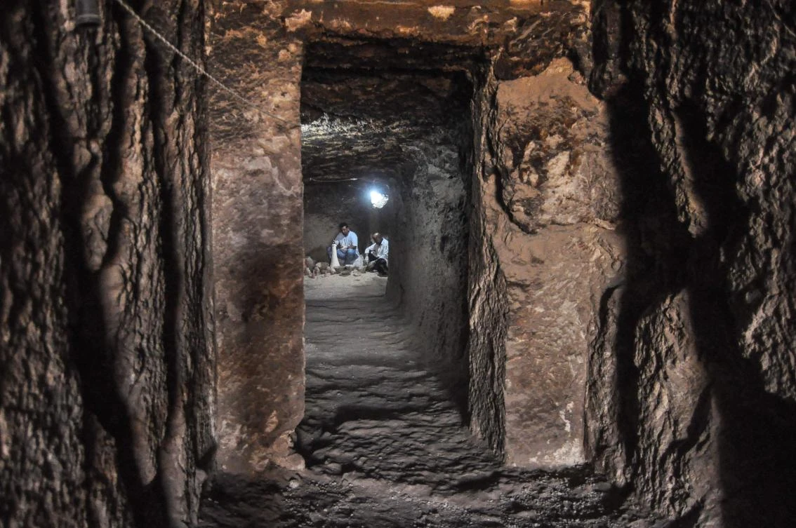 Egyptian archaeologists work inside a newly-discovered tomb of Shedsu-Djehuty at the Draa Abul Naga necropolis in Luxor's West Bank, 700 km south of Cairo, on April 18, 2019. (AFP)