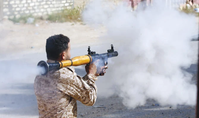 A Libyan fighter fires a rocket propelled grenade during clashes with forces loyal to Khalifa Haftar south of Tripoli’s suburb of Ain Zara, on Saturday. (AFP)